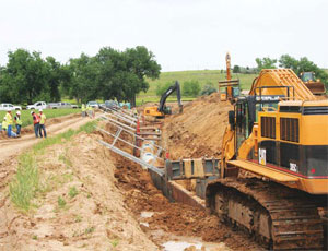 Approximately 34 miles of buried pipeline are being installed to transport water from the North Campus to the purification facility near the Aurora Reservoir. Measuring about 60 in. in diameter, the pipeline consists of mortar-lined, urethane-coated steel pipe.