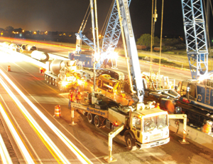Nighttime view of Pioneer Crossing highway project.
