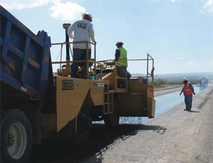 El Paso-based C&C Road Construction crews work on a $1.5-million stimulus project, rebuilding eight mi of U.S. Route 385 south of Fort Stockton in Pecos County.