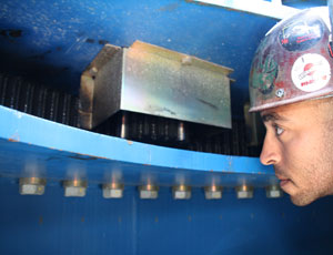 Hague inspects a ring gear that allows the crane to rotate.