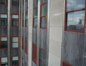 Instead of ordering 6,500 new windows, the team is simply refurbishing the existing ones, creating triple glazed panels, and performing the work from inside the building.