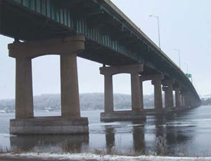 The I-80 bridge spanning the Mississippi River to connect LeClaire, Iowa, and the Moline area of western Illinois will see large-scale repairs this spring. Civil Constructors, of Moline and Freeport, Ill., will repair the end sections of floor beams that mount to the outside of the 43-year-old bridge’s main girders and support the outside lanes of the bridge deck. The floor beams’ ends are visible in the photo at left.