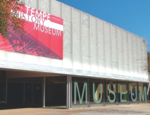 The Tempe Historical Museum�s former entryway (below) was demolished and replaced by an aluminum and glass storefront (above) with 72 LED lights that are programmed to wash the facade in four different colors. A 10-ft by 40-ft graphic scrim invites visitors to enter.
