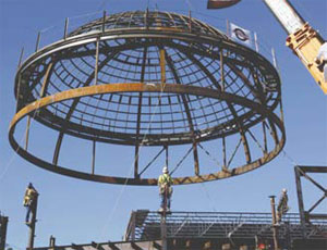 Crews lift the big dome into place at the re-invented Fort Worth Museum of Science and History.