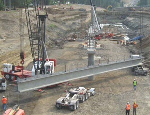 Girders are being placed on one of six bridges that are included in the U.S. 2 Lowering project between Farwell Road and Deadman Creek, part of the North Spokane Freeway megaproject. Other work under this contract includes retaining walls, paving for the interchange, frontage roads and a new 30-ft-wide arched culvert allowing for fish and wildlife passage.
