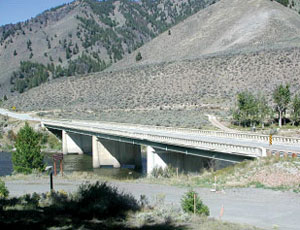 The new Slate Creek Bridge will be constructed 38 ft upstream, adjacent to the current bridge.