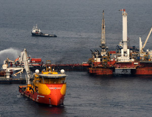 A Mobile offshore drilling unit holds position directly over the damaged Deepwater Horizon blowout preventer as crews work to plug the wellhead using a technique known as top kill on May 26, in the Gulf of Mexico. The failed procedure was intended to stem the flow of oil and gas and kill the well by injecting heavy drilling fluids through the blowout preventer on the seabed into the well.