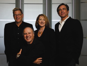 Current Nadel executives, from left, Patrick Winters, Joan Frei, and Greg Palaski join founder Herb Nadel of Nadel Architects (center)