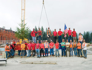 The construction team gathers to celebrate the raising of the final structural steel beam on the Swedish/Issaquah Campus in Issaquah Highlands, Wash. 