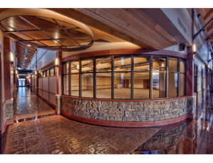 Design for the building created a western lodge feel, with a rustic stone-and-timber interior that mimics exterior finishes and provides a relaxed aesthetic that is also durable.