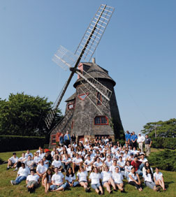 SUNY students on new South­ampton, N.Y., campus with icon of cleaner energy.