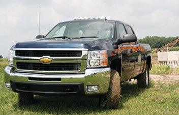 Silverado rides like a road warrior. Seat storage (far right) and cargo rack (bottom) are nice touches but feel cheap.