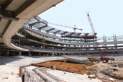 Job cut into discrete design and construction sequences, beginning on right field side, to save six months.