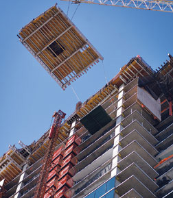 Spandrel-beam-free perimeter eases flying form construction, saves money.