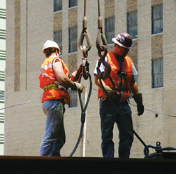 Smart riggers use edge protectors, or load “softeners,” to keep slings protected (above)
