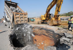 Contractor at Adjacent Site Rushes In To Fill Sink Hole in One Day