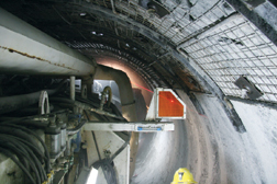Operators use a laser target on the side of the TBM to stay on track. Air conditioners on the machine and in the tunnel bring temperatures to a tolerable 84ºF.