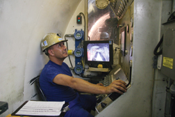 Operators use a laser target on the side of the TBM to stay on track. Air conditioners on the machine and in the tunnel bring temperatures to a tolerable 84ºF.