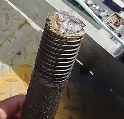 McGettigan holds broken slew bolt, extracted on May 30.