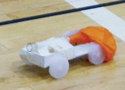 Students build motorized toy (top). 
