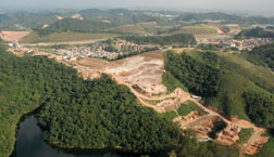 Beltway route cuts through forest near city reservoir, raising environmental concerns.