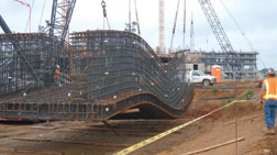 Rebar cage (top) for arch abutment part of buried concrete box.