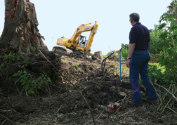 Corps is clearing levees as part of a nationwide program to ensure access.
