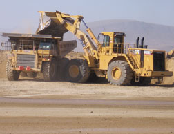Earthmovers go to work inside Nevada gold mine.