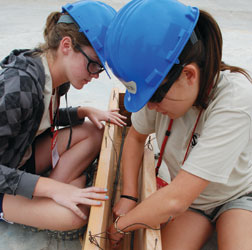 Students build form for concrete beam.