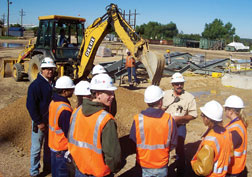 Officials of Bechtel’s open-shop unit, an NCCER supporter, take students to jobsite.