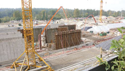 Primary tanks take shape as mat for bioreactors is placed. MBR system reduced overall footprint by 30%.