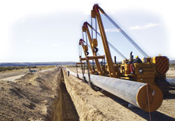 Laying Pipe in Remote, Frigid Patagonia. Buffeted by Antarctic winds, workers in southern Argentina must deal with deep cold that stops work for part of the year.