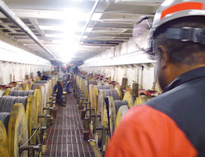 The operation requires a river of cable, fed up from below decks.