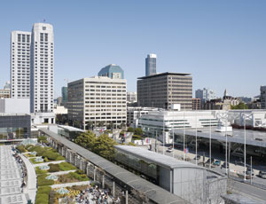 A seismic retrofit is part of plans to transform an unappealing 1960s-era office building (this image) into a sleek, daylight-filled structure (above).