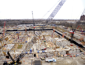 Once crews have a section of the foundation set, they go vertical, resulting in a tiered site that is at base slab in some areas and roof level in others.