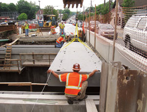 Hybrid-composite beam in New Jersey was installed with an excavator.