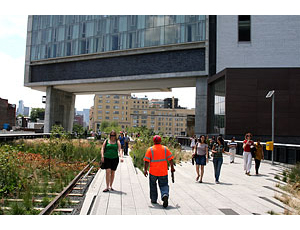 The 10-block-long first section of Manhattan’s 20-block-long High Line park, sits on an old railroad trestle that weaves its way under, over and alongside buildings.