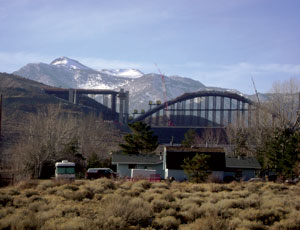 Rocky, rural terrain surrounds the Galena Creek Bridge, requiring special hoisting equipment.