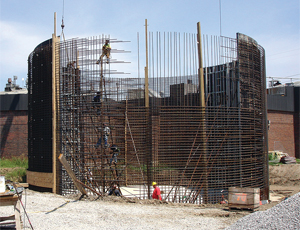 Crews build anaerobic digesters as part of waste-to-energy upgrade at a Kansas treatment plant.