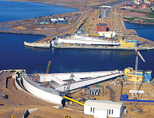 Pivot gates are poised to swing together and meet in mid-channel to halt floods threatening Saint Petersburg.