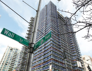 Problems of Seattle high-rise are too costly to fix, says owner. The contractor disagrees.