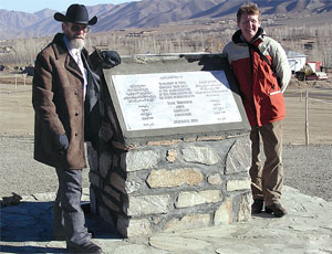 Engineer Myers (left) at memorial to workers killed during an Afghanistan road rehab project he managed.
