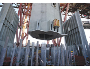 Steel tower legs are lifted into place for the San Francisco-Oakland Bay Bridge’s self-anchored suspension span.