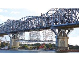 Firms Beat the Clock To Raise 2,648-Ton Section in Place on Mississippi’s Huey P. Long Bridge