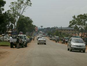 The current road to Entebbe Airport has heavy vehicular and pedestrian traffic.