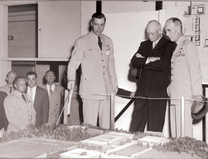 Witters (center) shows model to Lt. Gen. Hubert Harmon (right), the academy’s first superintendent, and Dwight Eisenhower in 1954. 
